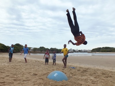 tumbling on the beach